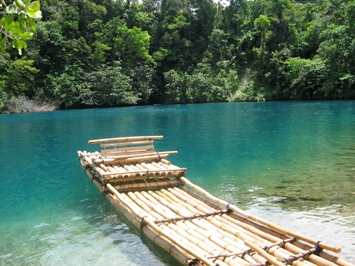 This photo of Jamaica's Blue Lagoon in Port Antonio was taken by London photographer Philip MacKenzie. Does anyone know what this type of boat is called?